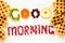 Good morning concept. `Good morning` words laid out with pieces of fruit and pomegranate seeds