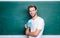 Good morning. Dose of caffeine. Teacher drink coffee chalkboard background. Handsome man enjoy hot coffee. Coffee