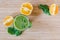 Good morning: Fresh green smoothie and fruits on wooden background, healthy breakfast. Text space