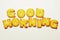 Good morning word from alphabet biscuits on white background