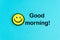 Good morning. Yellow emoticon on bright blue background