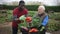 Good neighbors talk on the border of their farms