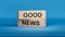 Good News symbol. Wooden blocks with words \'Good News\'. Wooden cube blocks.
