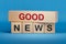 Good News symbol. Wooden blocks with words \'Good News\'. Wooden cube blocks.