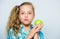 Good nutrition is essential to good health. Kid girl eat green apple fruit. Nutritional content of apple. Vitamin