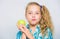 Good nutrition is essential to good health. Kid girl eat green apple fruit. Nutritional content of apple. Vitamin