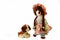 Good Puppy, Sit. Vintage girl rag doll with her puppy; presented on a plain white background.