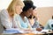 Good study habits make great students. female university students sitting in an exam room.