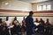 Good teams listen to their coach. Cropped shot of a rugby coach addressing his team players in a locker room during the