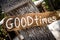 Good Times sign on wooden board