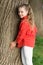 Good vibes only. Girl little cute child enjoy peace and tranquility at tree trunk. Place of power. Peaceful place. Find