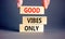 Good vibes only symbol. Concept word Good vibes only on beautiful wooden block. Businessman hand. Beautiful grey table grey