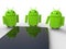 Google Android robots near a smart phone