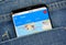 Google Flights on a phone screen in a pocket