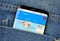 Google Flights on a phone screen in a pocket