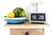 Google Nest Hub smart display and smart speaker on kitchen shelf