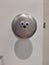 Googly eyes on a door knob, creating a surprised expression