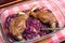 Goose legs baked on red cabbage