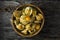 Gooseberries in Bowl on Rustic Wood