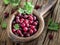 Gooseberries in the wooden bowl.