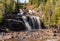 Gooseberry Falls in Tiers Down a Staircase of Rocky Cliffs