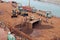 Gopalpur, India, November, 05, 2020. Accident at the port. Dump truck overturned while unloading iron ore. Work on lifting the tru