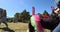 GoPro shot shows dog wearing colorful tutu at Halloween festival