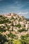 Gordes, Provence, France. Beautiful Scenic View Of Medieval Hilltop Village Of Gordes. Sunny Summer Sky. Famous Landmark