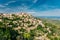 Gordes, Provence, France. Beautiful Scenic View Of Medieval Hilltop Village Of Gordes. Sunny Summer Sky. Famous Landmark