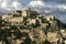 Gordes village in the Luberon, France under a moody sky.