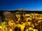 Goreme, Cappadocia, Turkey. View of the evening city from the mountain. Bright evening city and clear sky. Landscape in the summer