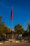 GOREME, TURKEY: Sculpture handshake holding the Turkish flag on the flagpole of the building in the center of Goreme