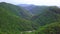 Gorge with River at Green Yilan Mountain Hills with Lush Foliage in Taiwan. Aerial View