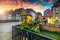 Gorgeous antique half-timbered facades with decorated street, Colmar, France