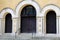 Gorgeous architecture with archways and detail in heavy doors of old building