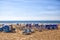 The gorgeous beach near Agadir in Morocco with luminous blue sky and blue beach chairs