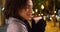 Gorgeous black female holds coffee cup, smiling at camera on the Champs-Elysees