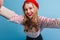 Gorgeous blonde girl with sincere smile taking selfie. Positive young woman in french beret posing on blue background