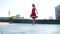 Gorgeous blonde woman performing contemporary dance outdoors in slow motion