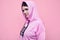 Gorgeous body positive Latin woman in a pink sports hoodie