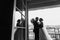 Gorgeous bride and stylish groom silhouettes at window light. Se