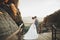Gorgeous bride and stylish groom walking at sunny landscape, wedding couple, luxury ceremony mountains with amazing view