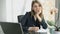 Gorgeous businesswoman talking to camera in office