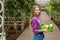 Gorgeous cheerful woman with a basket of lemon posing to the camera