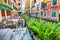 Gorgeous cityscape of Venice with narrow canals, boats and gondolas and bridges with traditional buildings