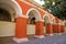 Gorgeous Cloister with Orange Red Columns and Wall Fresco Paintings in the Monastery of Santa Catalina, Arequipa, Peru