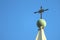 Gorgeous cross of the bell tower`s top of Basilica Cathedral of Arequipa against bright blue sky, Arequipa, Peru