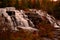 Gorgeous deep colors of Fall Enhance the view of  Bond Fall in Upper Michigan