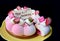 Gorgeous and delectable strawberry jelly vanilla mousse anniversary cake on black background