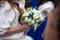 Gorgeous elegant happy bride holding stunning stylish bouquet